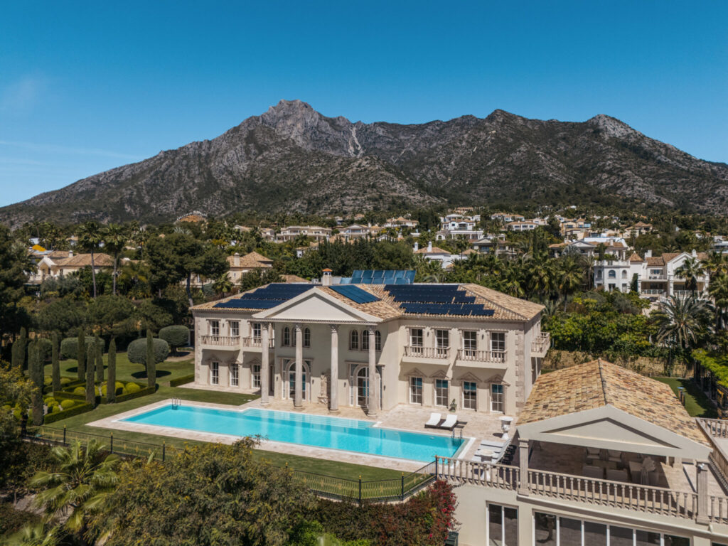 Classical mansion aerial view with pool
